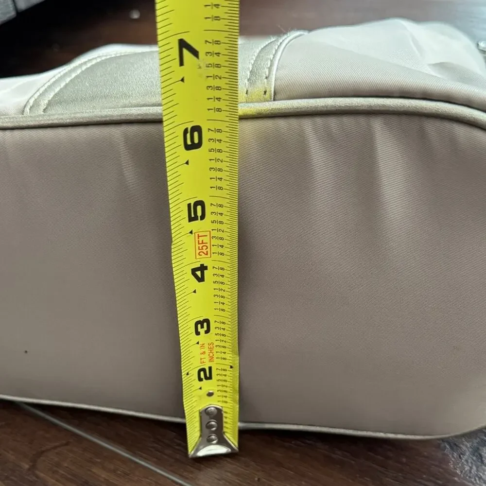 Neutral Taupe Woman’s Backpack with Metallic Accent and many zipper pockets. - Picture 13 of 13
